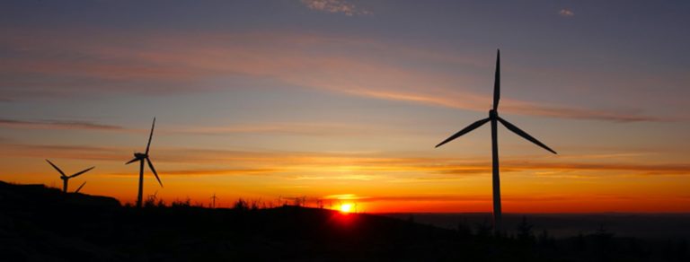 wind turbines at sunset