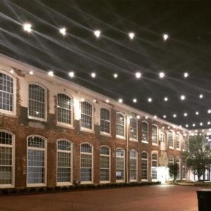 Revolution Mill Courtyard with string lights